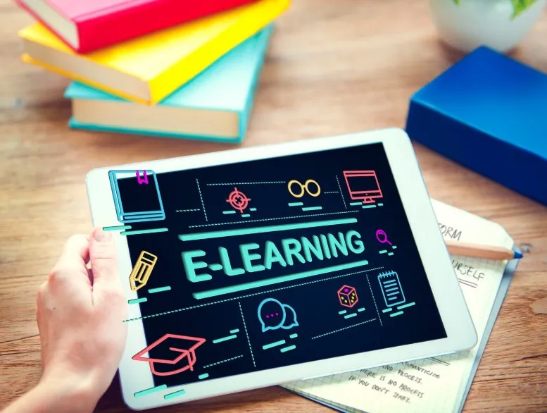 A tablet display icons and e-learning text on the screen.